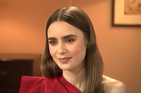Lily Collins w modnej stylizacji, prezentująca swój dynamiczny i elegancki wizerunek.